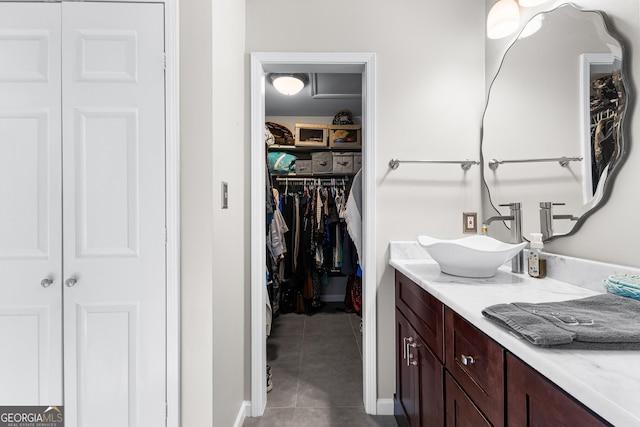 bathroom featuring tile patterned floors and vanity