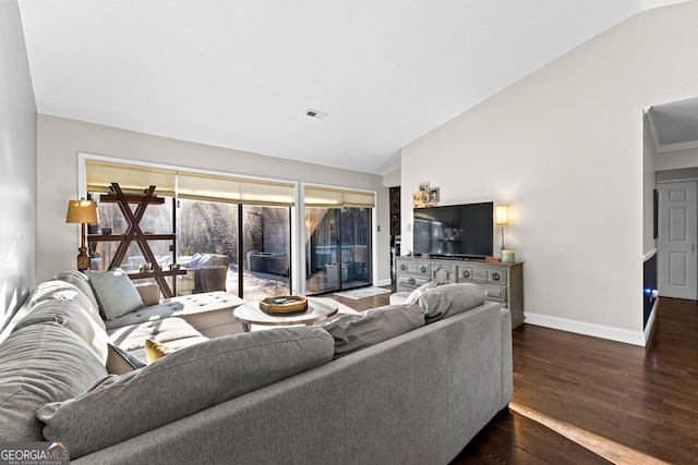 living room with dark hardwood / wood-style floors and vaulted ceiling