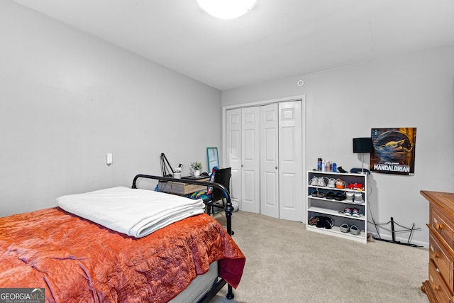 bedroom with light colored carpet and a closet