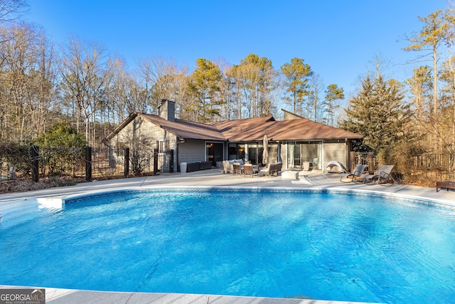 view of swimming pool featuring a patio