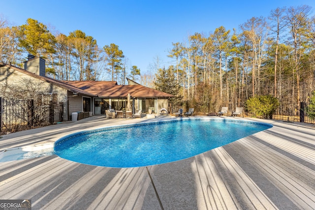 view of swimming pool featuring a patio