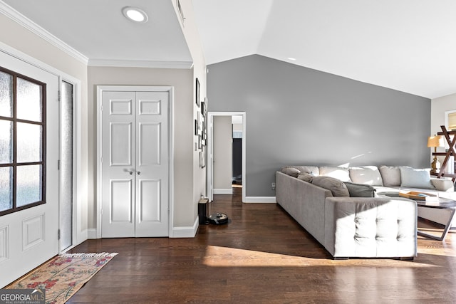 unfurnished living room with vaulted ceiling, a wealth of natural light, and dark wood-type flooring