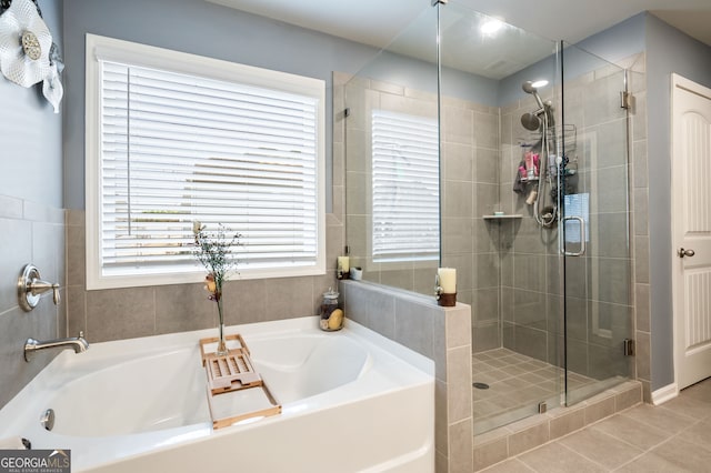 bathroom with tile patterned flooring and plus walk in shower