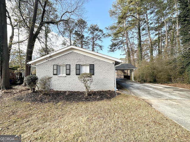 view of side of property with a carport