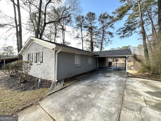 view of home's exterior with a carport