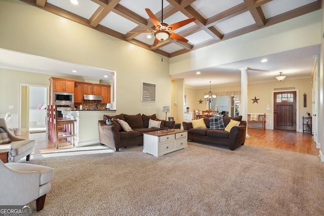 living room featuring ornate columns, coffered ceiling, beam ceiling, and light colored carpet