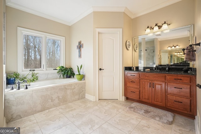 bathroom with ornamental molding, tiled bath, and vanity