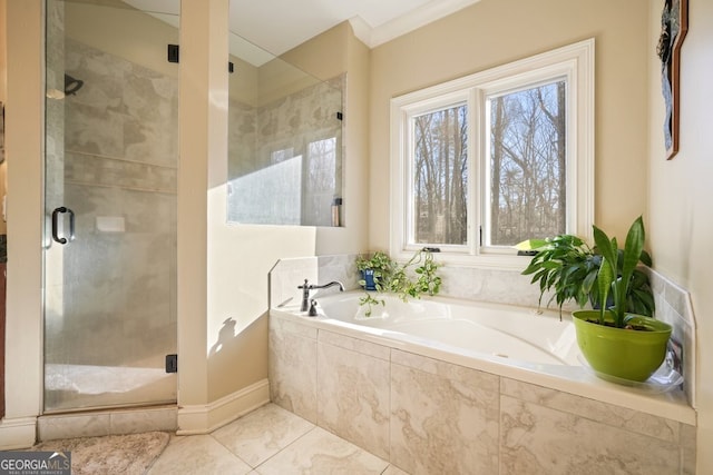 bathroom with crown molding and separate shower and tub