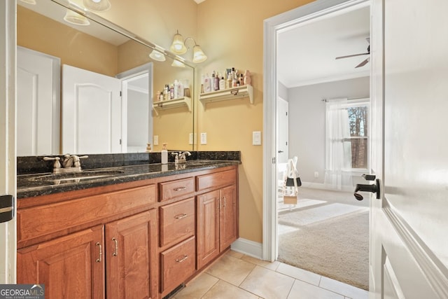 bathroom featuring ceiling fan, tile patterned floors, vanity, and ornamental molding