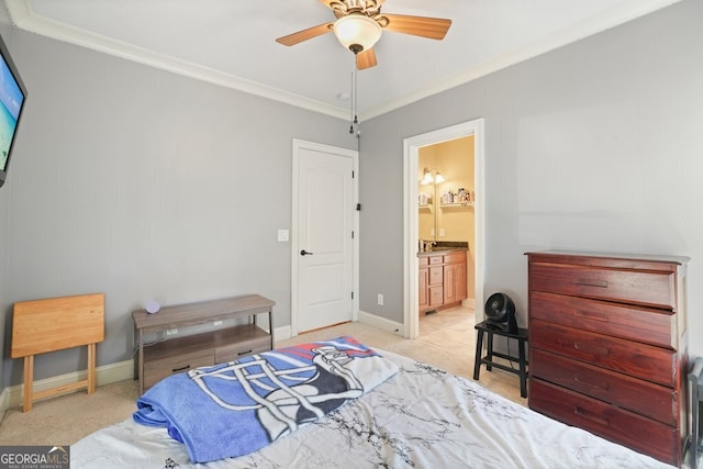 bedroom featuring ceiling fan, ornamental molding, and ensuite bath