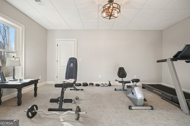 exercise area featuring a paneled ceiling