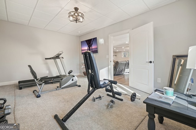 workout area featuring a paneled ceiling