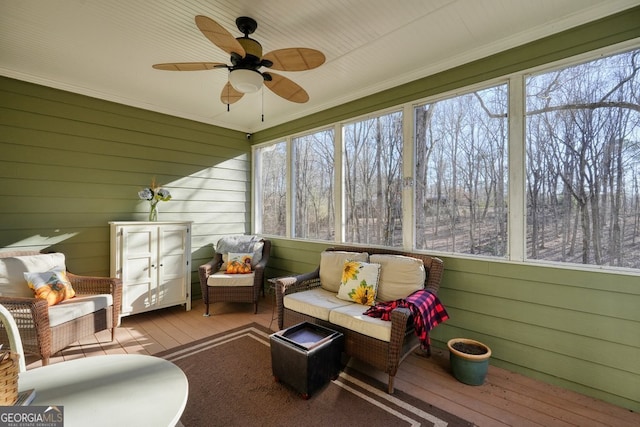 sunroom / solarium with ceiling fan and a healthy amount of sunlight