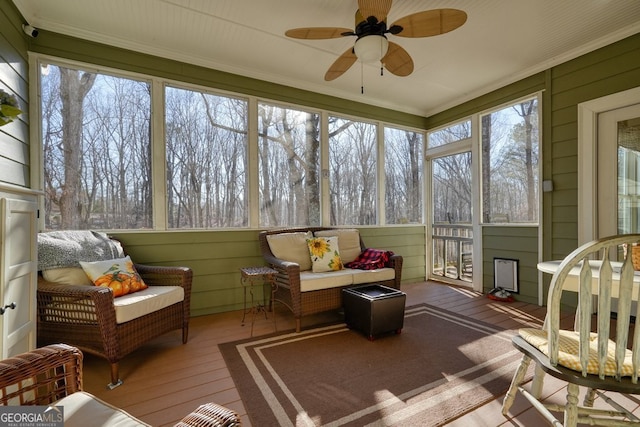 sunroom / solarium with ceiling fan