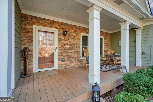 wooden terrace with a porch