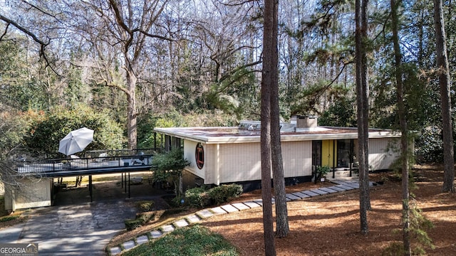 exterior space with a carport