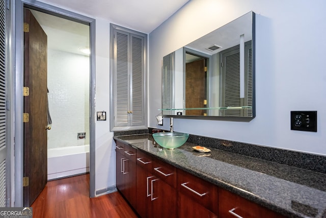 bathroom with wood-type flooring and vanity