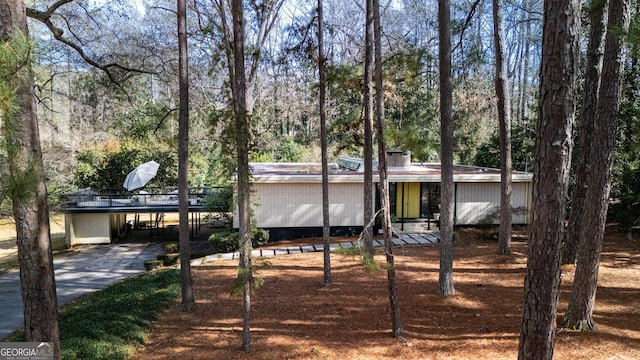 view of front of home featuring a carport