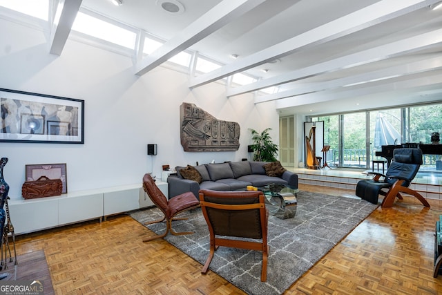 living room with beam ceiling and light parquet floors