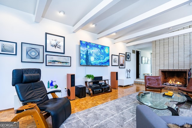 living room featuring a fireplace, parquet flooring, and beamed ceiling