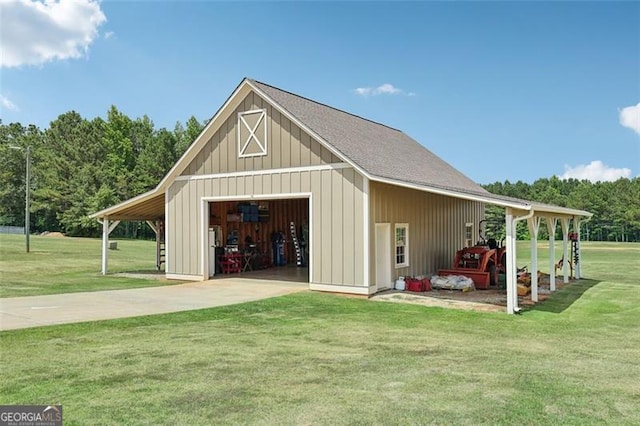 exterior space with a garage, a yard, and a carport