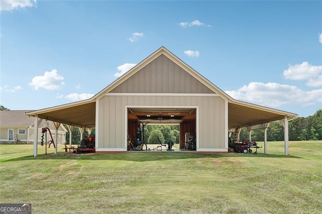 view of home's community with a lawn and an outdoor structure