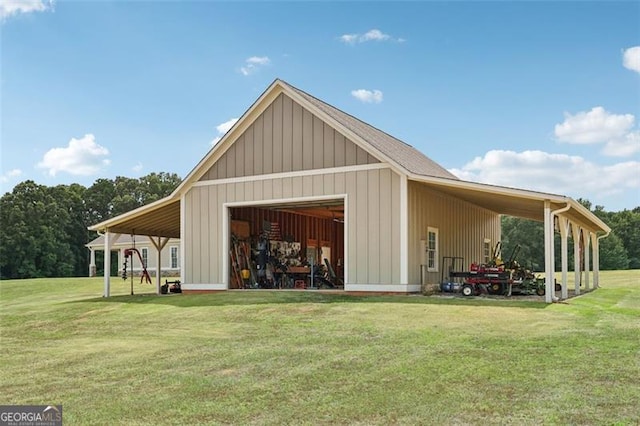 view of outbuilding featuring a garage and a yard