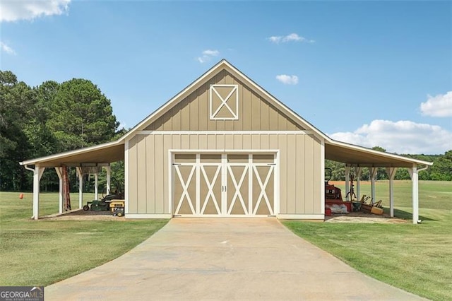 view of outdoor structure with a yard and a carport