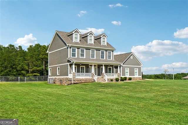 view of front of house with a porch, central AC unit, and a front yard