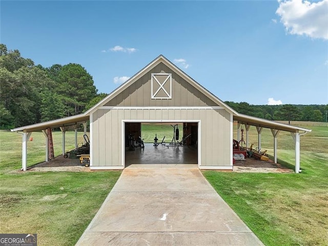 view of outdoor structure featuring a yard and a garage