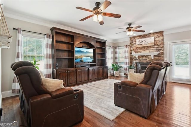 living room featuring ornamental molding, plenty of natural light, and dark hardwood / wood-style flooring