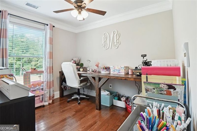 home office featuring dark wood-type flooring, ceiling fan, and crown molding