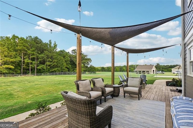 wooden terrace featuring outdoor lounge area and a lawn