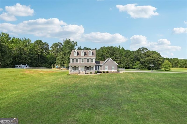 view of front of home with a front yard and covered porch