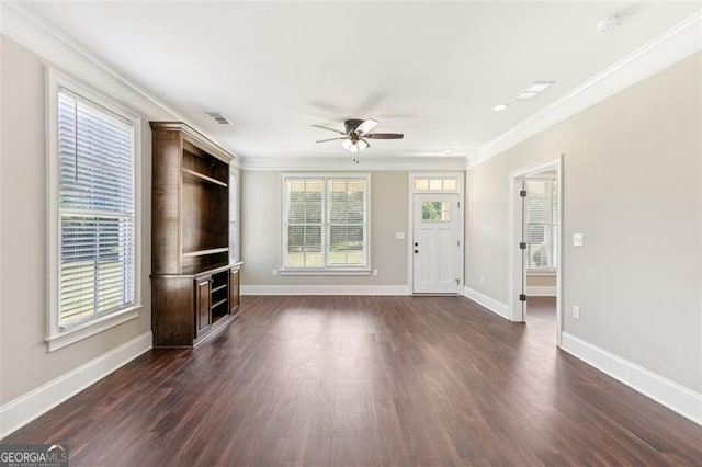 unfurnished living room featuring crown molding, ceiling fan, and dark hardwood / wood-style floors