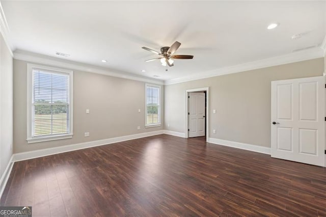 unfurnished room with ornamental molding, dark wood-type flooring, and ceiling fan