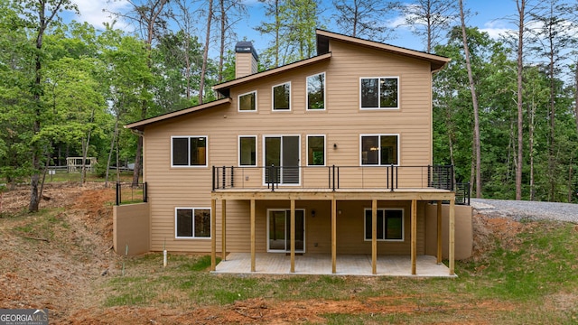 rear view of property featuring a patio