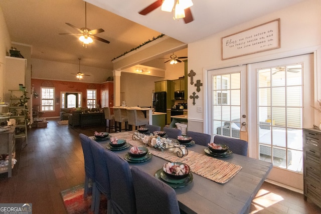 dining room with hardwood / wood-style flooring, french doors, and vaulted ceiling