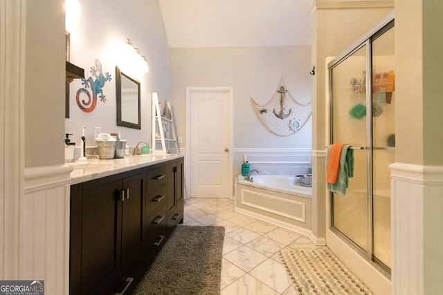 bathroom featuring plus walk in shower, lofted ceiling, and vanity