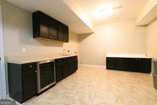 kitchen featuring sink and beverage cooler