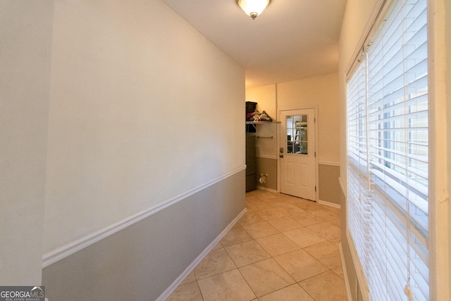 hallway with light tile patterned flooring