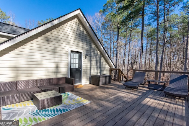 wooden deck with an outdoor hangout area