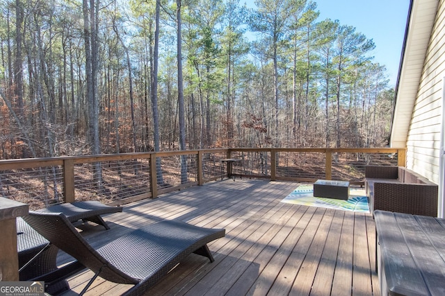 wooden terrace featuring an outdoor hangout area