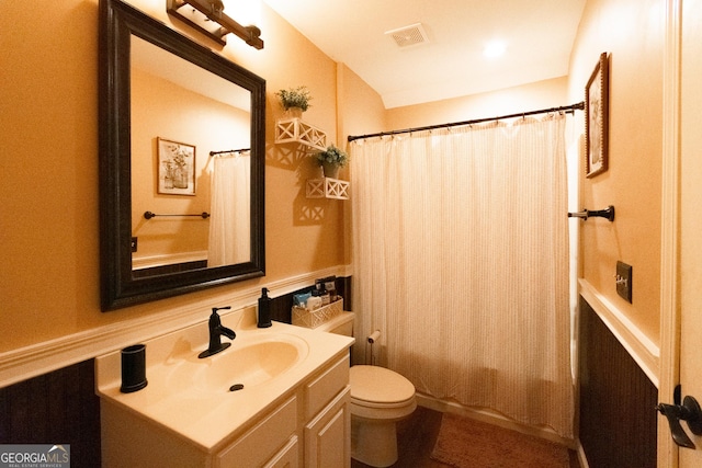 bathroom with toilet and vanity