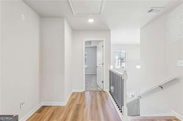 corridor featuring light hardwood / wood-style floors