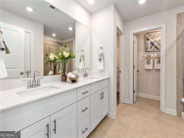 bathroom featuring tile patterned floors and vanity