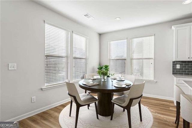 dining area with light wood-type flooring