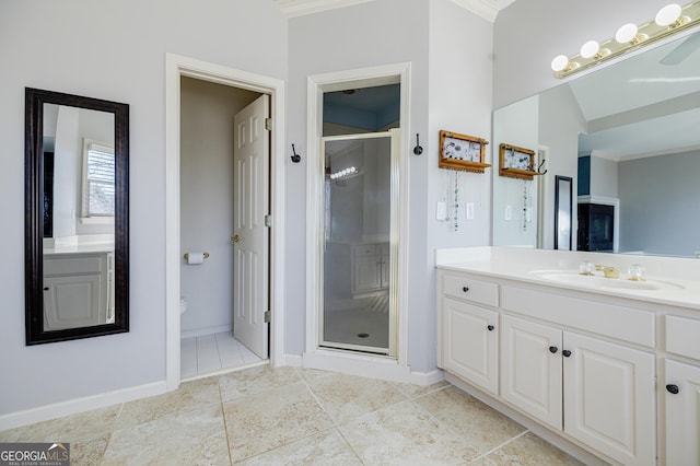 bathroom with tile patterned floors, walk in shower, vanity, and toilet