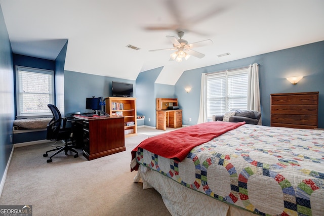 carpeted bedroom with ceiling fan and lofted ceiling