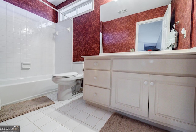 full bathroom with toilet, tile patterned flooring, tiled shower / bath, and vanity